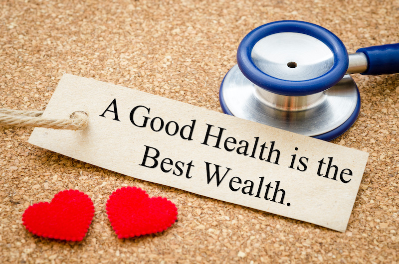 A good health is the best wealth card and stethoscope with red heart on wood table. Medical concept.